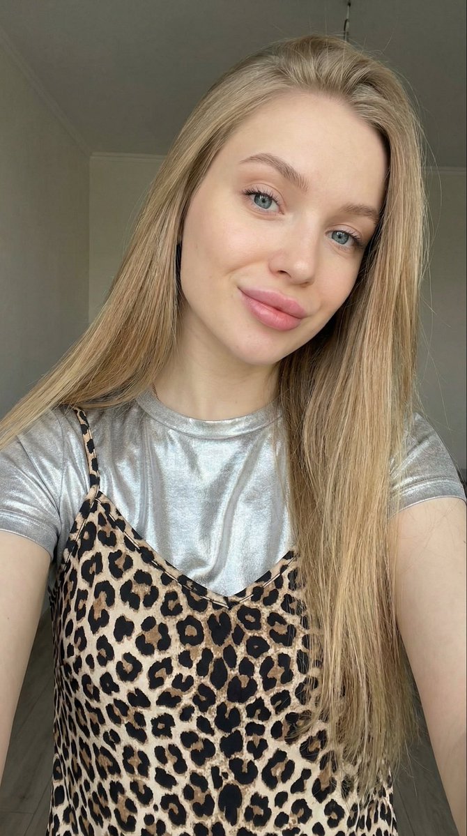 Close-up Selfie of a Young Woman with Leopard Print Top