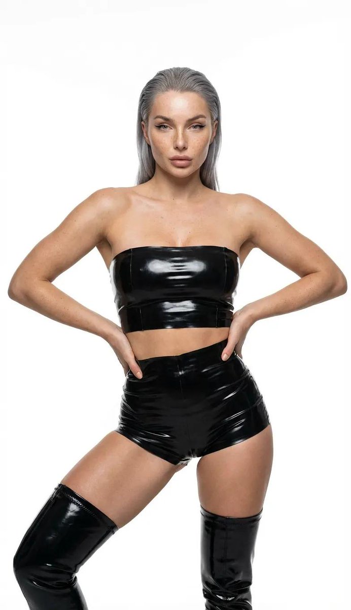 Ultra-realistic high-fashion studio photography of a woman in black latex 2