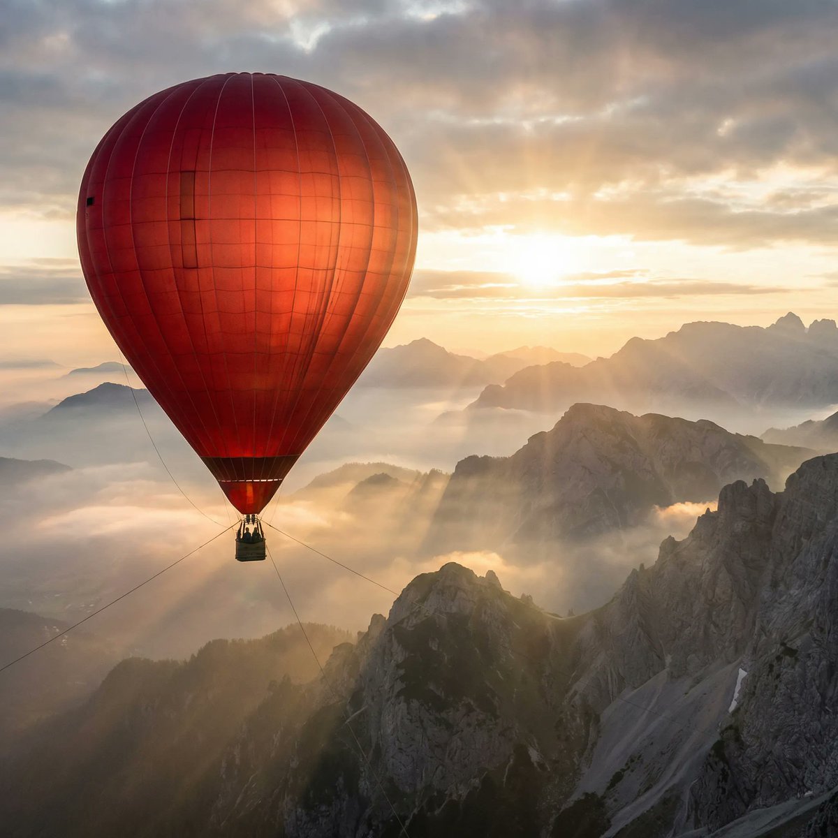 Giant Red Balloon Above Misty Mountains