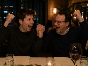 Two Men Celebrating at a Restaurant – GPT Image 2 prompt by BubbleBrain