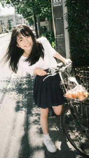 Vintage Film Portrait of Girl with Bicycle – GPT Image 2 prompt by BubbleBrain
