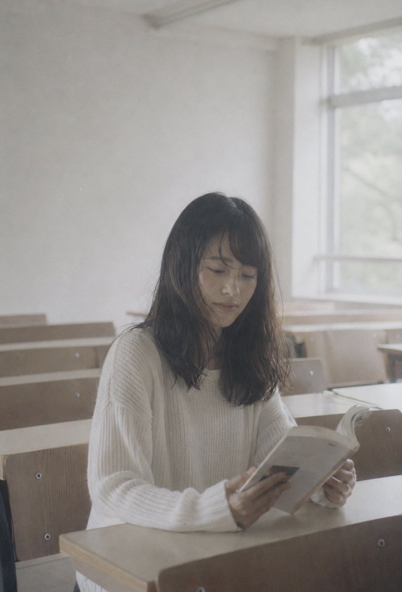 Faceless Student Reading in Classroom