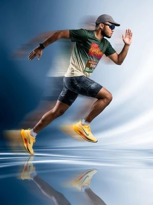 Dynamic Athletic Motion Blur — Dynamic sports fashion campaign photo of a male athlete sprinting mid-air, intense motion blur effect, long exposure photography,