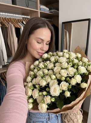 Cozy Flower Selfie — Do not change the facial features. Photo aspect ratio 3:4.

A vertical home-style photograph with a “cozy moment” aesthetic, taken with a f
