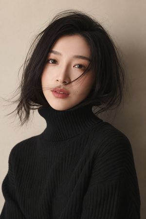 Soft Studio Portrait in Black Turtleneck — Create a highly realistic studio portrait of {argument name="subject" default="a young East Asian woman"} from the ch