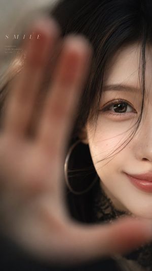 Close-Up Smile Portrait — Create a realistic close-up emotional portrait of {argument name="character description" default="a young East Asian woman with long b