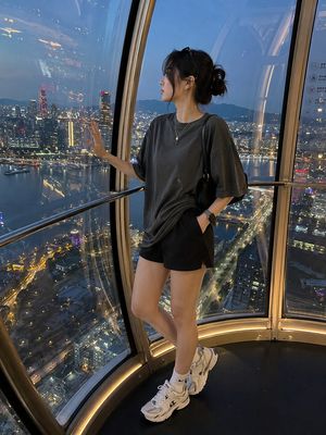 Candid Luxury Ferris Wheel Portrait — Use the same {argument name="subject" default="Korean female"} from the reference image. Preserve her facial identity exac
