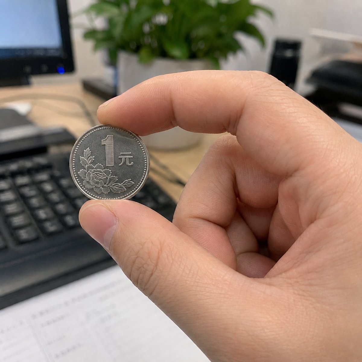 Hand Pinching One-Yuan Coin