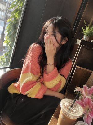 Cozy Cafe Window Portrait — Photorealistic cinematic café portrait of a beautiful adult woman with long, naturally wavy {argument name="hair color" default="dar