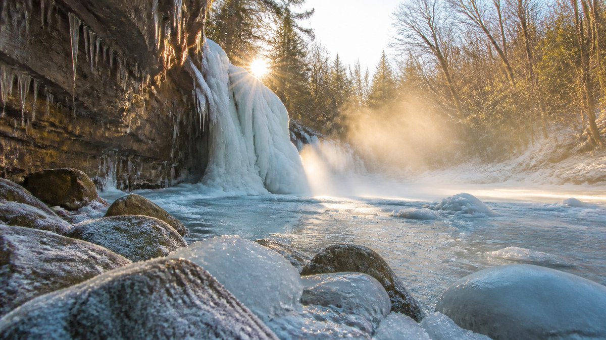 Frozen Waterfall Sunlit Crystal Landscape