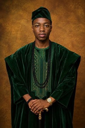 Premium Yoruba Agbada Studio Portrait — Create an ultra-realistic premium studio portrait of {argument name="subject" default="a young adult Yoruba man"} wearin