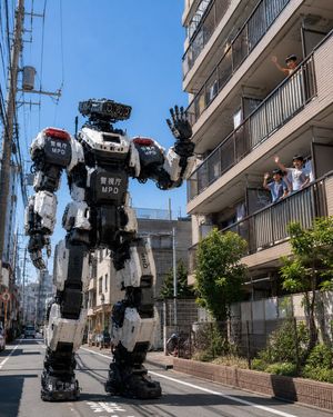 Tokyo Police Robot Neighborhood Patrol — Create a photorealistic cinematic street scene in modern Tokyo on a clear sunny day: a massive humanoid police patrol r