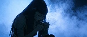 Blue Smoke Anime Cigarette Scene — Create a cinematic dark anime-style widescreen frame of {argument name="character description" default="a young woman with ve